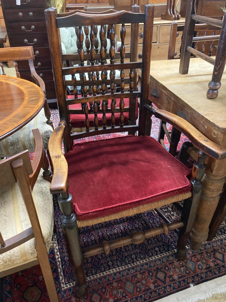 A harlequin set of eleven 19th century ash spindle back rush seat chairs